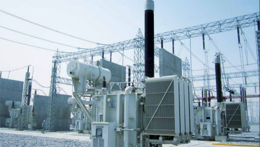 Electric power transformer station with high-voltage lines and clear sky